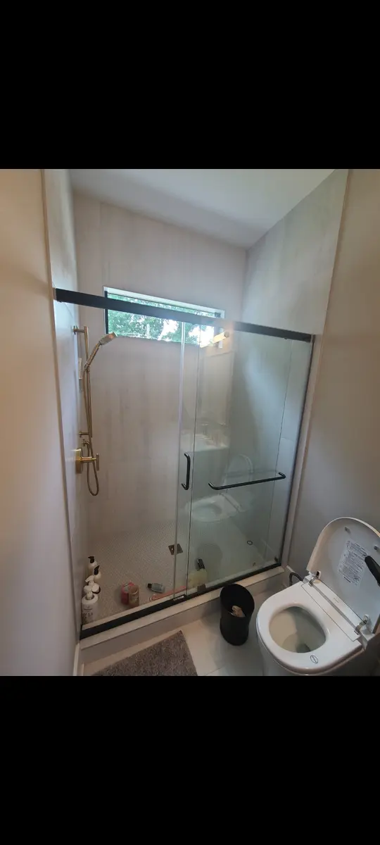 Basement Finishing — Sliding shower door and bathroom fixtures